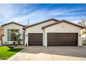 Charming single-story home with a well-manicured lawn, inviting curb appeal, and a two-car garage at 1737 E Marquette Dr, Gilbert, AZ 85234