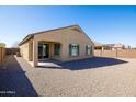 Spacious backyard featuring low maintenance gravel and a covered patio at 19202 W Jackson St, Buckeye, AZ 85326