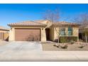 Charming single story home with a two car garage and low maintenance landscaping at 19202 W Jackson St, Buckeye, AZ 85326