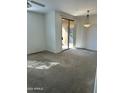 Spacious carpeted bedroom with sliding glass door and modern light fixture at 20100 N 78Th Pl # 1007, Scottsdale, AZ 85255