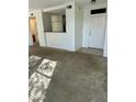 Open living room with neutral carpet and bright white walls at 20100 N 78Th Pl # 1007, Scottsdale, AZ 85255