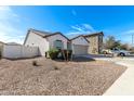 Beautiful single-story home with low-maintenance desert landscaping in the front yard at 20183 W Monroe St, Buckeye, AZ 85326