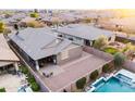 Aerial view of a private backyard oasis with pool, patio, and desert landscaping in a gated community at 20742 E Mockingbird Dr, Queen Creek, AZ 85142