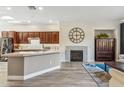 A lovely living room shows the fireplace and wood floors at 20750 N 87Th St # 1137, Scottsdale, AZ 85255