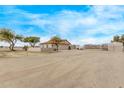 This stunning house is located on a spacious lot with ample parking for vehicles and equipment at 21520 W Watkins St, Buckeye, AZ 85326