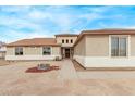 Charming single-story home features a landscaped yard and neutral colored exterior at 21520 W Watkins St, Buckeye, AZ 85326