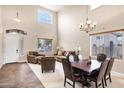 Spacious living room featuring vaulted ceiling, neutral color palette, and well-appointed furniture arrangements at 21798 N Ingram Ct, Maricopa, AZ 85138