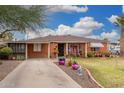 A charming single-story brick home featuring a well-maintained front yard and covered porch at 2230 N 14Th Pl, Phoenix, AZ 85006