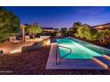 Exterior image featuring a private pool, desert landscaping, and a stone patio at 23236 N Caleta Ct, Sun City West, AZ 85375