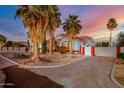 Beautiful single-story home with a red tile roof, vibrant landscaping, and an attached garage at 2903 S 271St Ln, Buckeye, AZ 85326