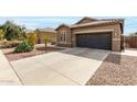 Charming home featuring a well-kept lawn, desert landscaping and an attached two-car garage at 3031 W Cottonwood Ln, Phoenix, AZ 85045