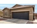 Charming home featuring a well-kept lawn, desert landscaping and an attached two-car garage at 3031 W Cottonwood Ln, Phoenix, AZ 85045