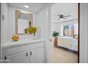 Bright bedroom featuring stylish vanity area and sliding doors leading to backyard at 3033 N 37Th St # 14, Phoenix, AZ 85018