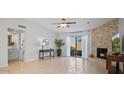 Spacious living room featuring tile flooring, fireplace, sliding glass doors, and neutral paint colors at 3033 N 37Th St # 14, Phoenix, AZ 85018