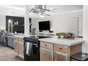 Spacious kitchen featuring a large island, modern appliances, and seamlessly connected to the living area at 402 E Muriel Dr, Phoenix, AZ 85022