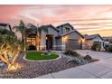 Beautifully landscaped home featuring desert landscaping and a bright green lawn at 4365 E Anderson Dr, Phoenix, AZ 85032