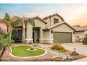 Inviting home exterior features desert landscaping and a neutral color palette at 4365 E Anderson Dr, Phoenix, AZ 85032