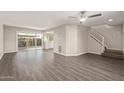 Bright living room featuring sleek flooring, neutral walls, and sliding door to patio at 4703 N 26Th Ln, Phoenix, AZ 85017