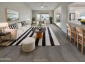 Bright and airy living room featuring neutral tones, stylish furniture, and a contemporary design at 5432 E Juniper Ave, Scottsdale, AZ 85254