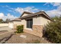 Exterior view of a well-maintained home with low-maintenance landscaping at 6060 W Charter Oak Rd, Glendale, AZ 85304