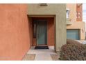 Inviting front entrance with a green door and manicured landscaping at 7601 E Roosevelt St # 1007, Scottsdale, AZ 85257