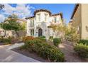 Stunning two-story home with colorful landscaping and a unique turret design at 958 S Henry Ln, Gilbert, AZ 85296