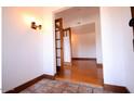 Inviting entryway with tile flooring and wood accents that leads to hardwood floors at 9620 S 156Th Pl, Gilbert, AZ 85234