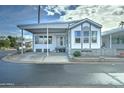 Charming home with a covered carport and landscaped front yard offering a welcoming curb appeal at 111 S Greenfield Rd # 660, Mesa, AZ 85206