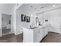 Modern kitchen island features a sink and dishwasher, perfect for cooking and entertaining at 1130 N 2Nd St # 411, Phoenix, AZ 85004