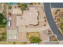 An aerial view of the residence showcasing the home's layout, pool, and lush landscaping on a spacious lot at 1349 E Anasazi St, Mesa, AZ 85203