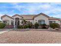 Attractive home with a neutral color scheme, gravel yard, mature landscaping, and architectural accents at 1349 E Anasazi St, Mesa, AZ 85203