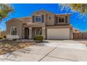 Charming two-story home featuring a well-manicured lawn and an attached two-car garage at 1481 E Lark St, Gilbert, AZ 85297