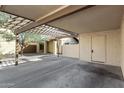 Spacious carport area with partial overhead trellis next to the residence at 14851 N 25Th Dr # 11, Phoenix, AZ 85023