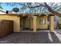 Inviting home exterior featuring a gravel yard, a covered entryway, and a security door at 14851 N 25Th Dr # 11, Phoenix, AZ 85023