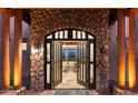 Grand entrance featuring a stone archway and double doors leading into a bright, inviting living space at 15504 E Firerock Country Club Dr, Fountain Hills, AZ 85268