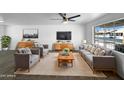 Bright living room featuring modern decor, stylish furniture, and a large window with neighborhood views at 1801 W 5Th Pl, Mesa, AZ 85201