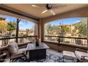 A cozy balcony with comfortable seating and views of the landscaped courtyard at 19700 N 76Th St # 1061, Scottsdale, AZ 85255