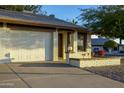 Inviting home with a two-car garage, brick accents, and manicured landscaping offering curb appeal at 2064 S Farnsworth Dr # 43, Mesa, AZ 85209