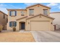 Two story home featuring blue shutters and tan stucco exterior at 28282 N Castle Rock Dr, San Tan Valley, AZ 85143