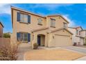 Two story home featuring blue shutters and tan stucco exterior at 28282 N Castle Rock Dr, San Tan Valley, AZ 85143