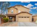 Two-story home featuring a well-manicured yard, covered porch, and a two car garage at 32 W Desert Vista Trl, San Tan Valley, AZ 85143