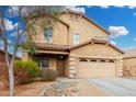 Two-story home featuring a well-manicured yard, covered porch, and a two car garage at 32 W Desert Vista Trl, San Tan Valley, AZ 85143