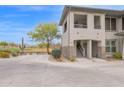 Charming condo with stone accents, stairs to a private balcony and landscaping at 33575 N Dove Lakes Dr # 1038, Cave Creek, AZ 85331