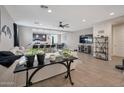 Bright, open-concept living room and kitchen area with modern furnishings and a neutral color palette at 4143 E Appaloosa Rd, Gilbert, AZ 85296