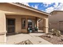 Cozy front porch with seating area and desert landscaping, offering a welcoming entrance at 545 N Bluejay Dr, Gilbert, AZ 85234