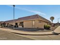 Corner lot exterior shot of a well-maintained single-story home with desert landscaping and clearly visible house number at 601 W Yukon Dr # 1, Phoenix, AZ 85027