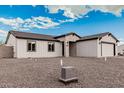 Charming single-story home featuring white siding, a gray roof, and a paved driveway at 6223 S Eagle Pass Rd, Gold Canyon, AZ 85118