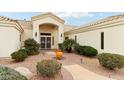 Inviting front entrance showcasing a decorative fountain and lush, desert landscaping at 6460 E Trailridge Cir # 2, Mesa, AZ 85215