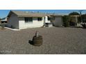 Expansive backyard with low maintenance gravel landscaping and mature shade trees at 10612 N 102Nd Dr, Sun City, AZ 85351