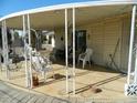 Relaxing covered patio area, perfect for outdoor dining and entertaining guests at 10612 N 102Nd Dr, Sun City, AZ 85351